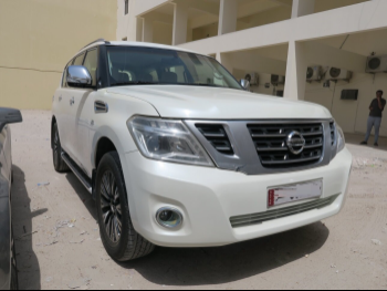 Nissan  Patrol  SE  2014  Automatic  318,000 Km  8 Cylinder  Four Wheel Drive (4WD)  SUV  White