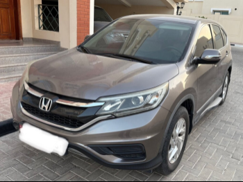 Honda  CRV  LX  2015  Automatic  72,095 Km  4 Cylinder  Rear Wheel Drive (RWD)  SUV  Black and Gray