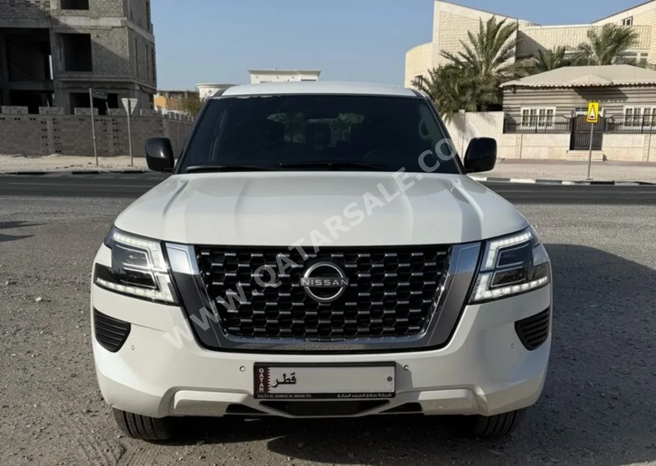 Nissan  Patrol  XE  2022  Automatic  57,000 Km  6 Cylinder  Four Wheel Drive (4WD)  SUV  White  With Warranty