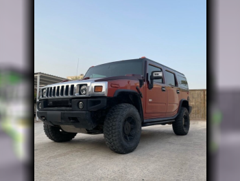 Hummer  H2  2006  Automatic  206,000 Km  8 Cylinder  Four Wheel Drive (4WD)  SUV  Black and Orange