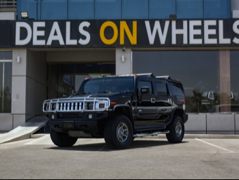 Hummer  H2  2005  Automatic  100,000 Km  8 Cylinder  Four Wheel Drive (4WD)  SUV  Black