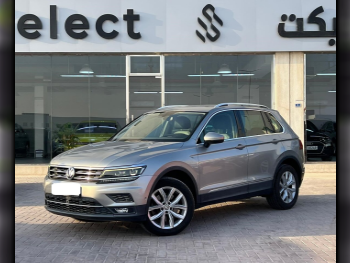 Volkswagen  Tiguan  2.0 TSI  2018  Automatic  60,000 Km  4 Cylinder  All Wheel Drive (AWD)  SUV  Silver