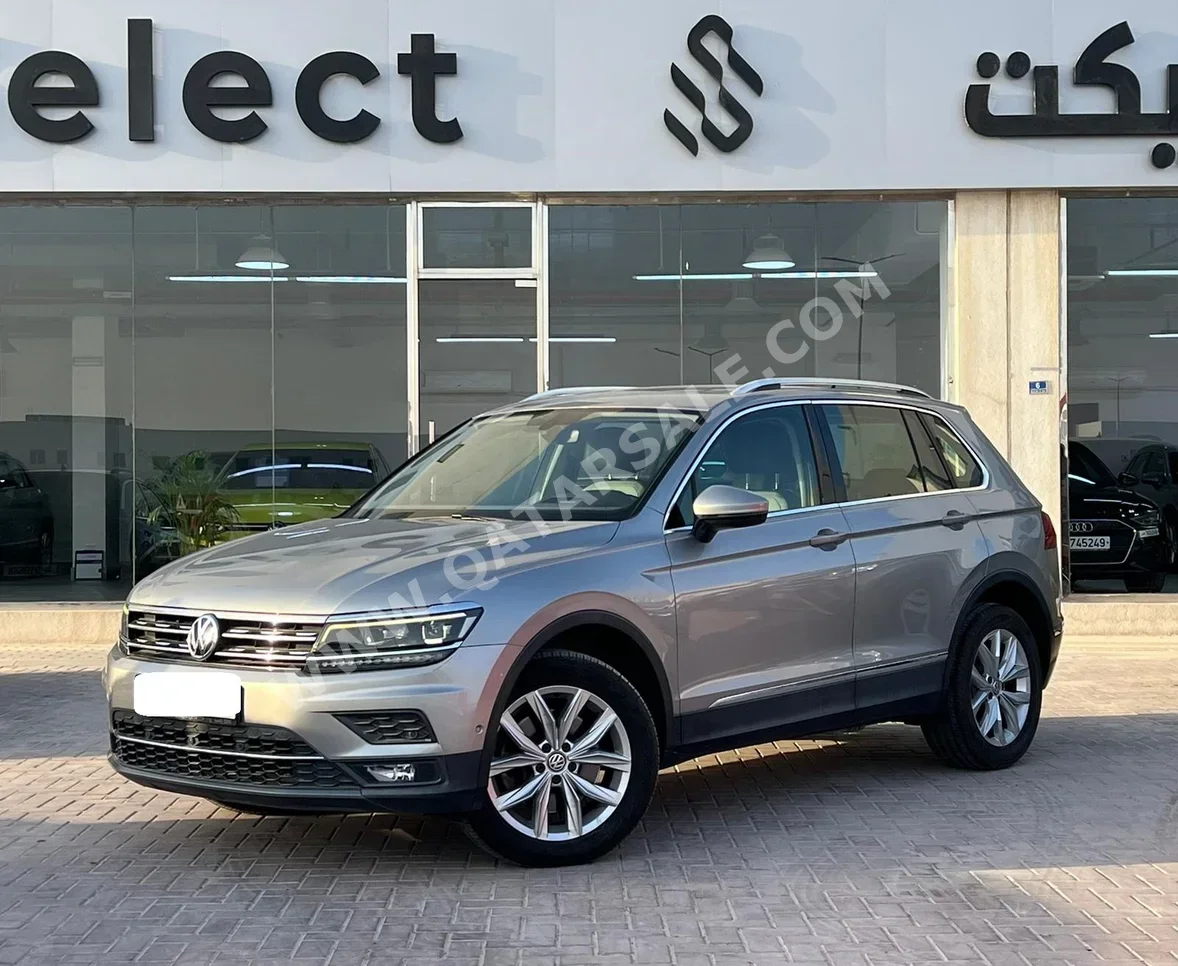 Volkswagen  Tiguan  2.0 TSI  2018  Automatic  60,000 Km  4 Cylinder  All Wheel Drive (AWD)  SUV  Silver
