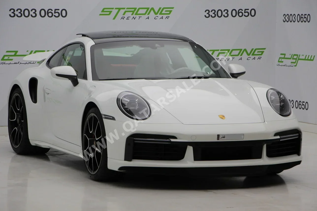 بورش  911  توربو  2023  اوتوماتيك  14,000 كم  6 سلندر  دفع خلفي  كوبيه \ سبورت  أبيض  تحت الضمان