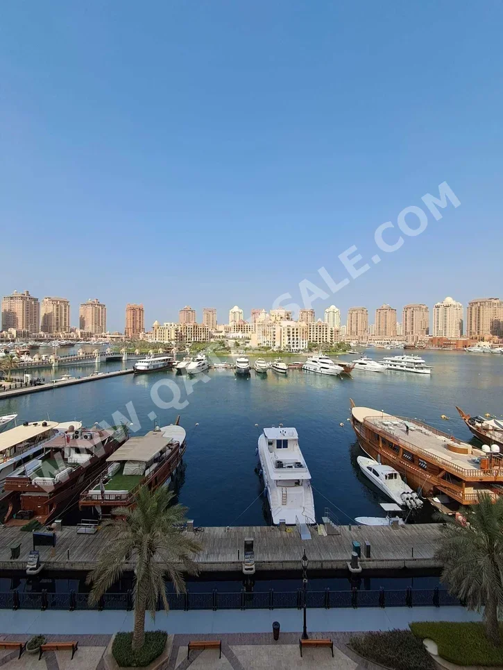 2 Bedrooms  Apartment  For Rent  in Doha -  The Pearl  Fully Furnished