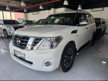 Nissan  Patrol  Platinum  2015  Automatic  114,000 Km  8 Cylinder  Four Wheel Drive (4WD)  SUV  White