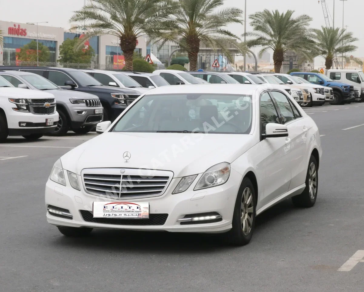Mercedes-Benz  E-Class  200  2013  Automatic  88,000 Km  4 Cylinder  Rear Wheel Drive (RWD)  Sedan  White