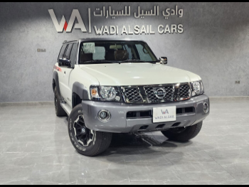 Nissan  Patrol  Super Safari  2022  Automatic  19,000 Km  6 Cylinder  Four Wheel Drive (4WD)  SUV  White