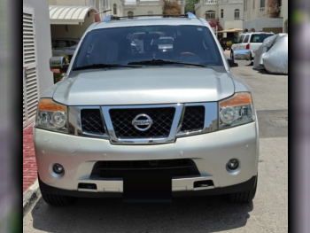 Nissan  Armada  LE  2015  Automatic  135,000 Km  8 Cylinder  Four Wheel Drive (4WD)  SUV  Silver