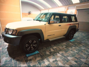 Nissan  Patrol  Super Safari  2024  Automatic  0 Km  6 Cylinder  Four Wheel Drive (4WD)  SUV  Beige  With Warranty