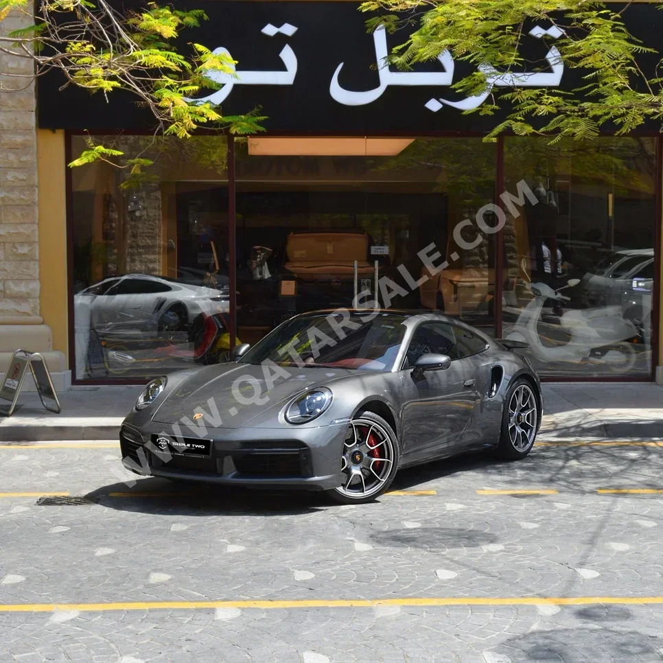 بورش  911  توربو  2023  اوتوماتيك  16,900 كم  6 سلندر  دفع خلفي  كوبيه \ سبورت  رمادي  تحت الضمان