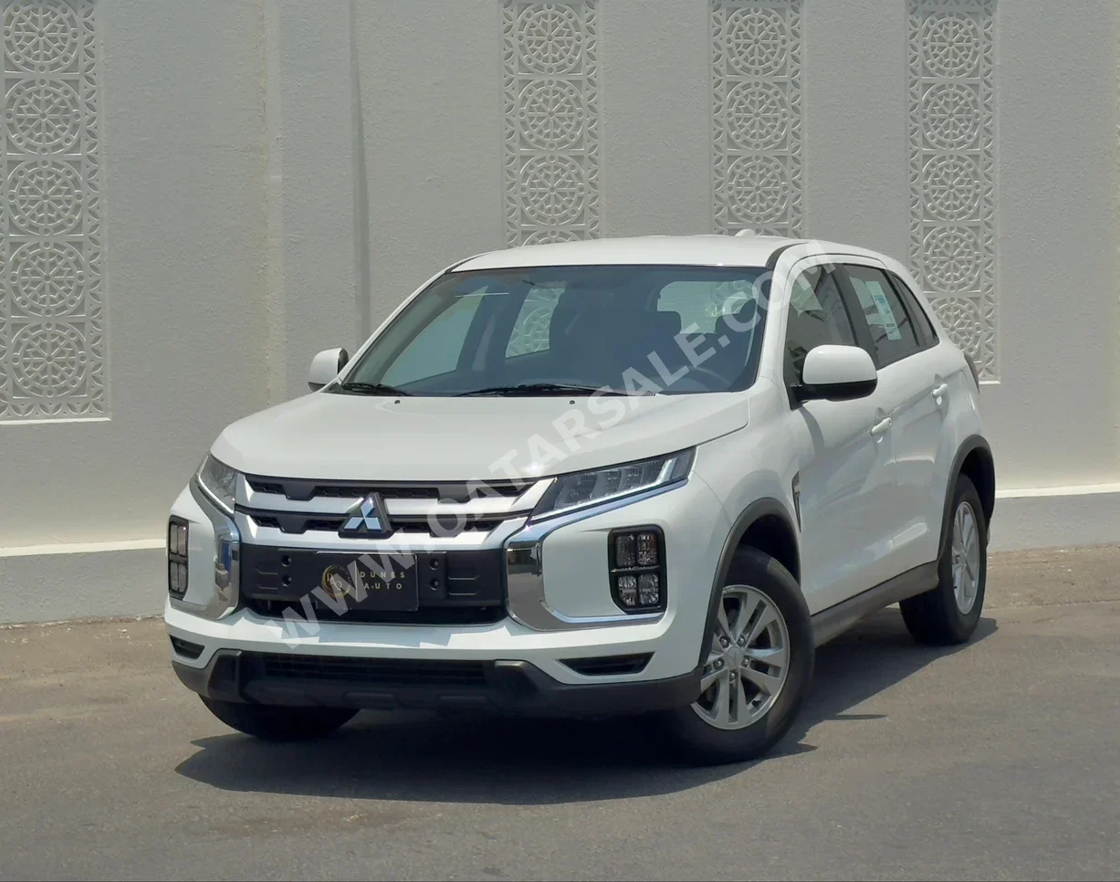 Mitsubishi  ASX  2023  Automatic  28,000 Km  4 Cylinder  Front Wheel Drive (FWD)  SUV  White  With Warranty