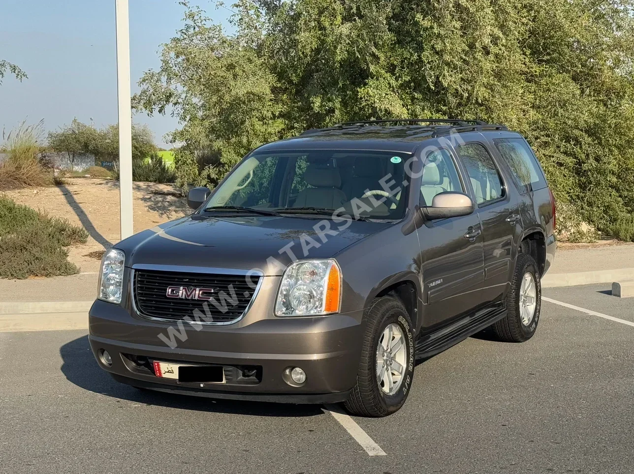 GMC  Yukon  SLE  2013  Automatic  122,700 Km  8 Cylinder  Rear Wheel Drive (RWD)  SUV  Brown