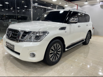 Nissan  Patrol  Platinum  2014  Automatic  224,000 Km  8 Cylinder  Four Wheel Drive (4WD)  SUV  White
