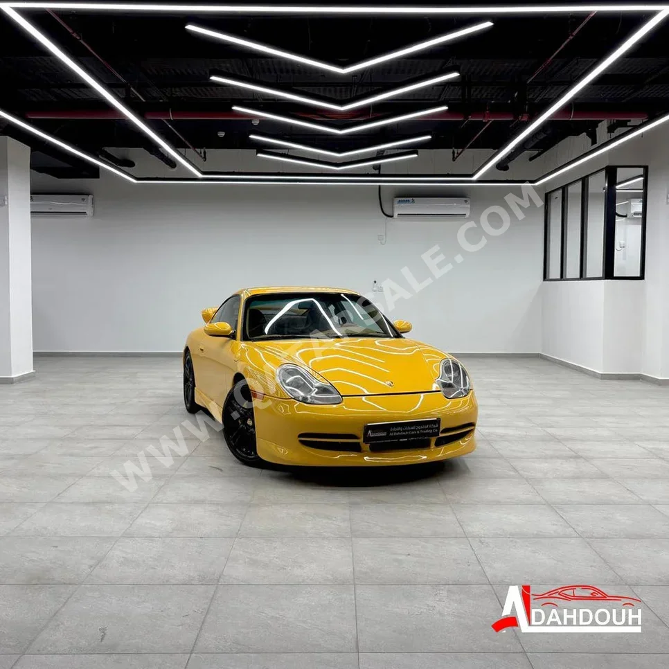 بورش  911  كاريرا  2001  اوتوماتيك  181,000 كم  6 سلندر  دفع خلفي  كوبيه \ سبورت  أصفر