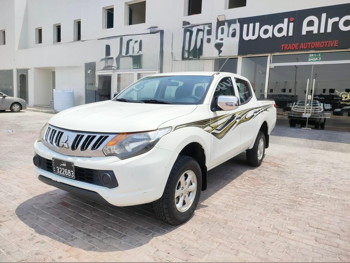 Mitsubishi  L 200  2019  Manual  124,000 Km  4 Cylinder  Four Wheel Drive (4WD)  Pick Up  White
