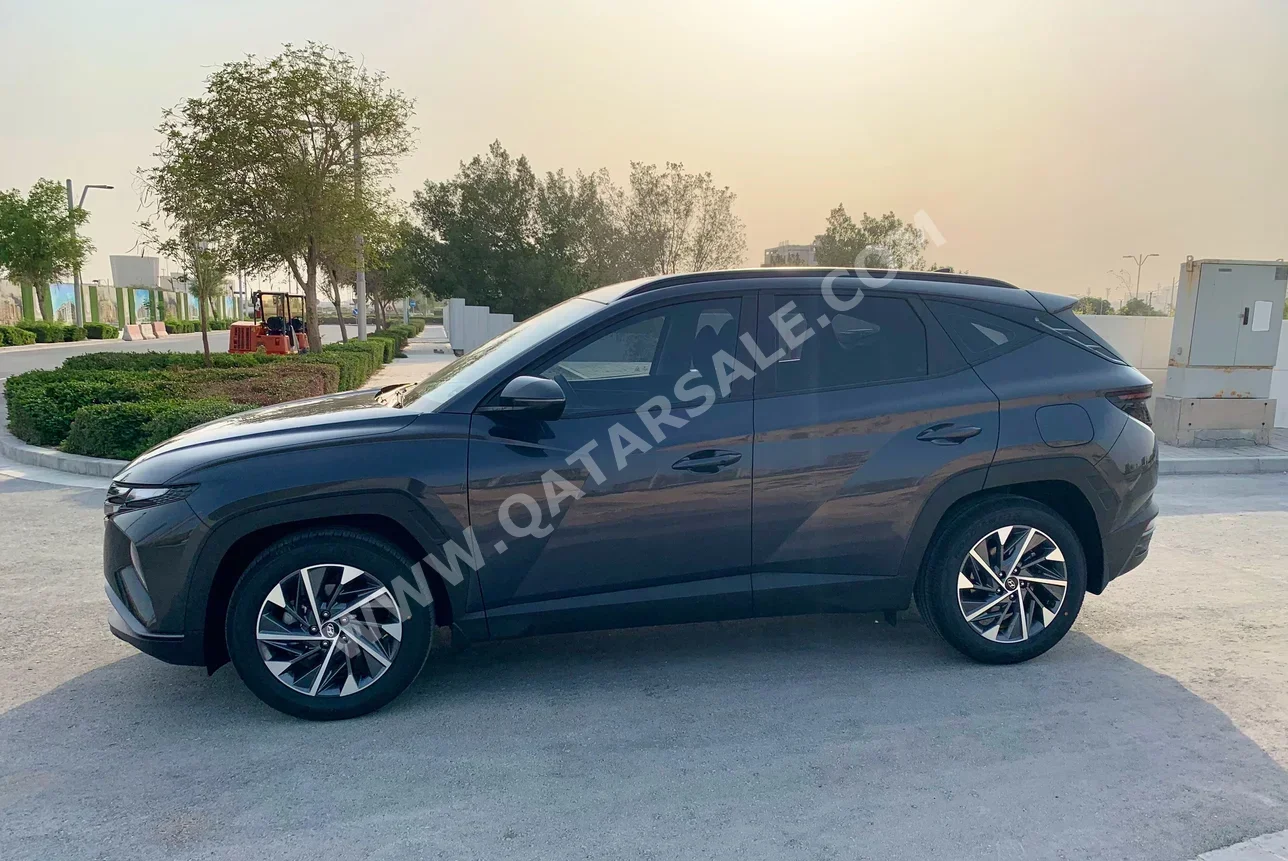 Hyundai  Tucson  2022  Automatic  64,392 Km  4 Cylinder  Front Wheel Drive (FWD)  SUV  Dark Gray  With Warranty