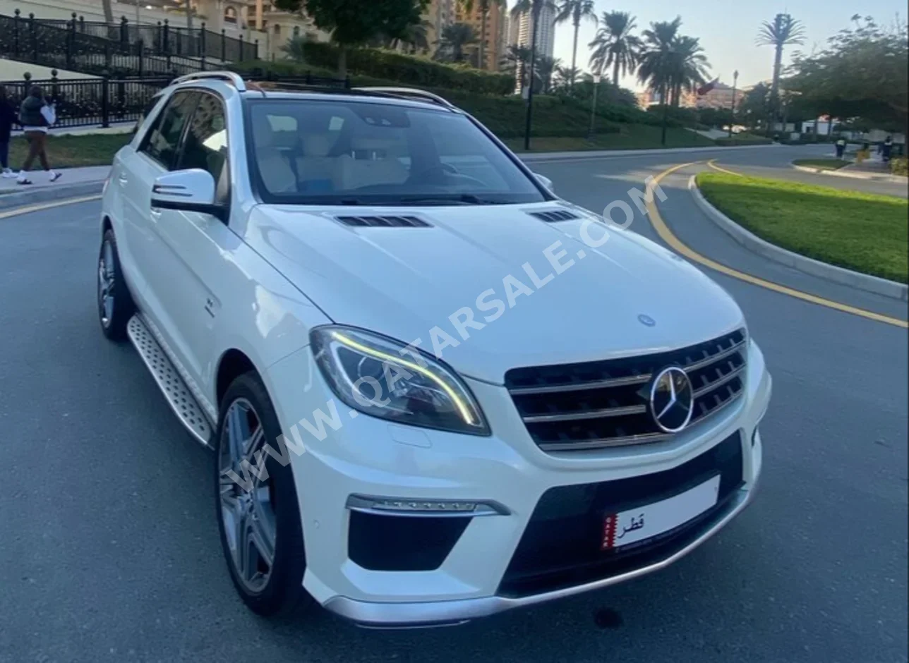 Mercedes-Benz  ML  63 AMG  2013  Automatic  119,300 Km  8 Cylinder  All Wheel Drive (AWD)  SUV  White