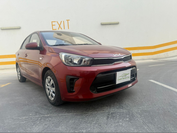 Kia  Pegas  4 Cylinder  Sedan  Dark Red  2022