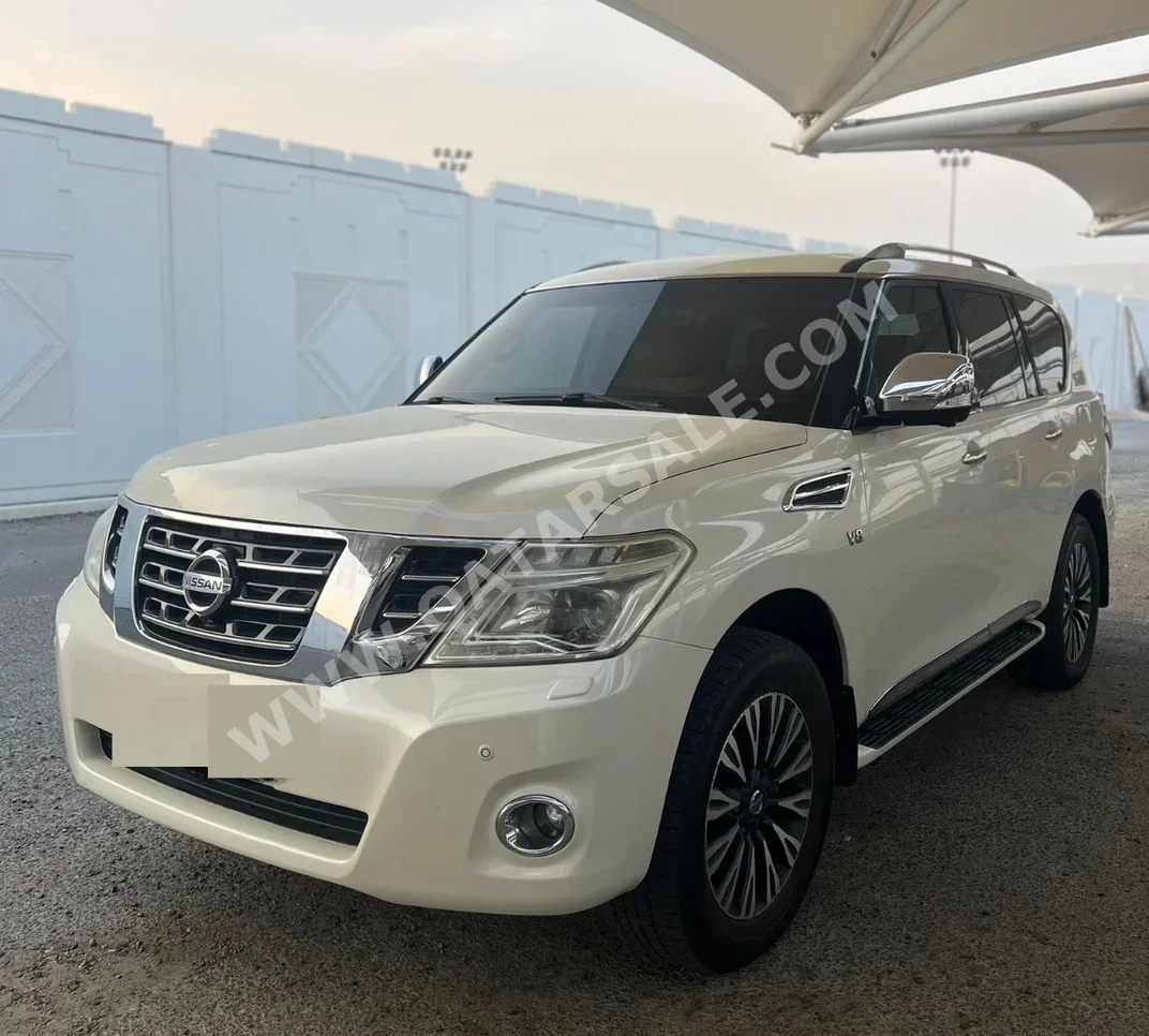 Nissan  Patrol  Platinum  2014  Automatic  341,000 Km  8 Cylinder  Four Wheel Drive (4WD)  SUV  White