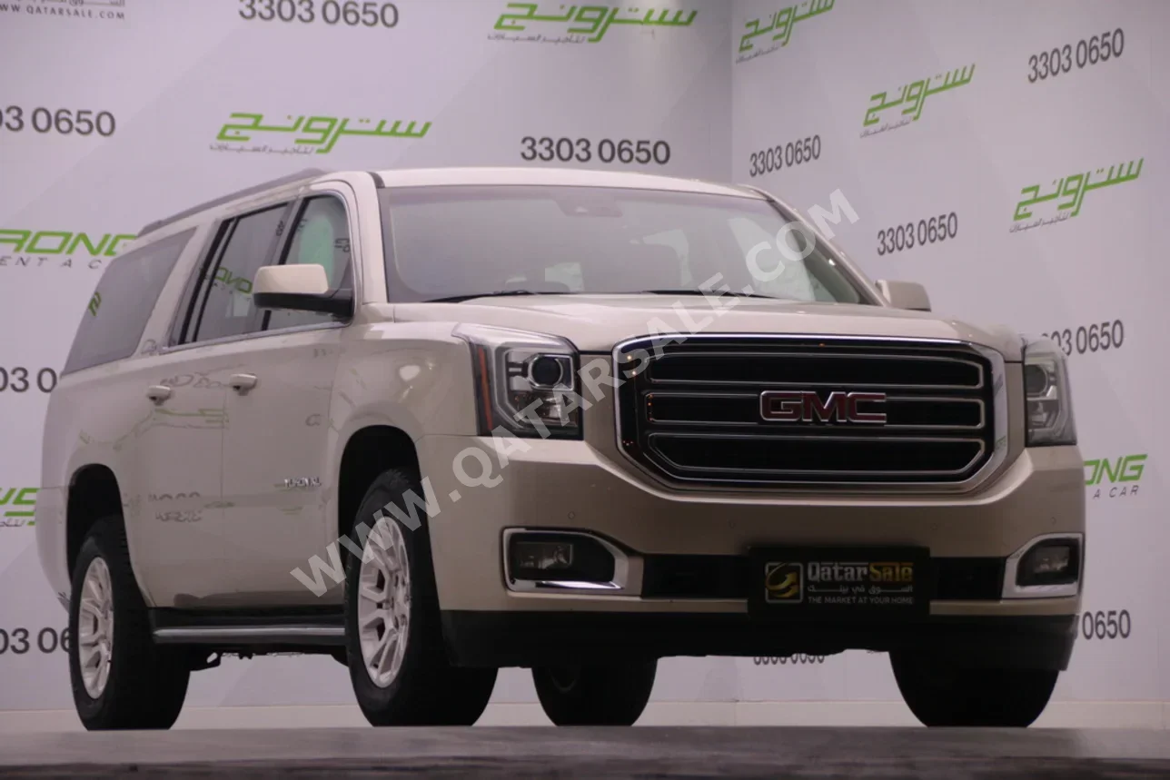 GMC  Yukon  XL  2015  Automatic  243,000 Km  8 Cylinder  Four Wheel Drive (4WD)  SUV  Gold