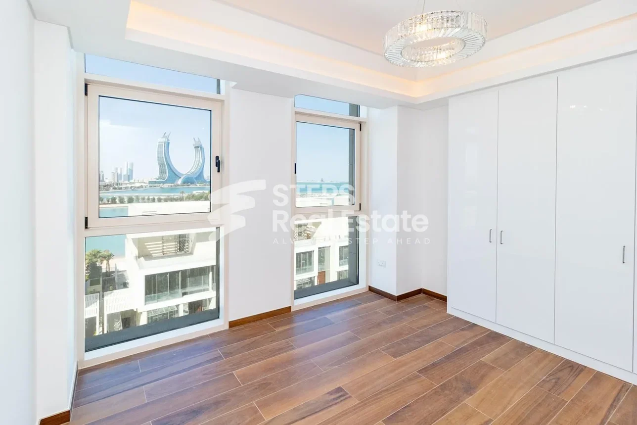 2 Bedrooms  Apartment  For Rent  in Doha -  The Pearl  Semi Furnished