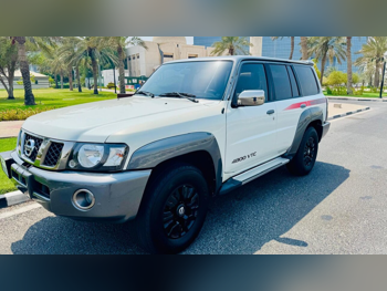 Nissan  Patrol  Super Safari  2018  Automatic  125,400 Km  6 Cylinder  Four Wheel Drive (4WD)  SUV  White and Gray