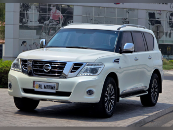 Nissan  Patrol  Platinum  2015  Automatic  395,000 Km  8 Cylinder  Four Wheel Drive (4WD)  SUV  White  With Warranty