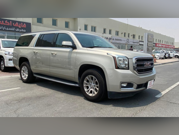GMC  Yukon  XL  2016  Automatic  218,000 Km  8 Cylinder  Four Wheel Drive (4WD)  SUV  Gold