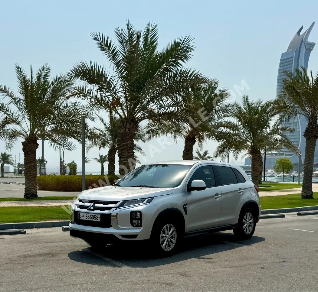 Mitsubishi  ASX  2024  Automatic  31,000 Km  4 Cylinder  Front Wheel Drive (FWD)  SUV  Silver  With Warranty
