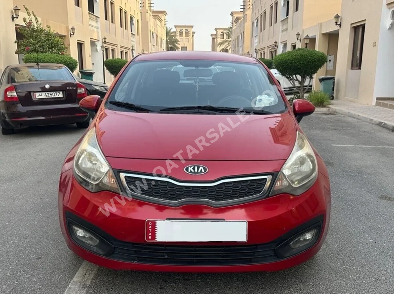 Kia  Rio  2014  Automatic  86,265 Km  4 Cylinder  Front Wheel Drive (FWD)  Sedan  Red  With Warranty