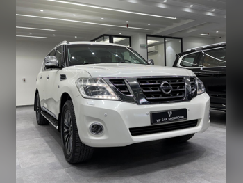 Nissan  Patrol  Platinum  2014  Automatic  159,000 Km  8 Cylinder  Four Wheel Drive (4WD)  SUV  Pearl