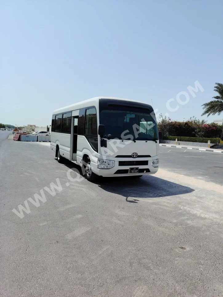 Toyota  Coaster  2022  Manual  83,000 Km  4 Cylinder  Rear Wheel Drive (RWD)  Van / Bus  White