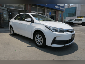 Toyota  Corolla  2018  Automatic  128,000 Km  4 Cylinder  Front Wheel Drive (FWD)  Sedan  White