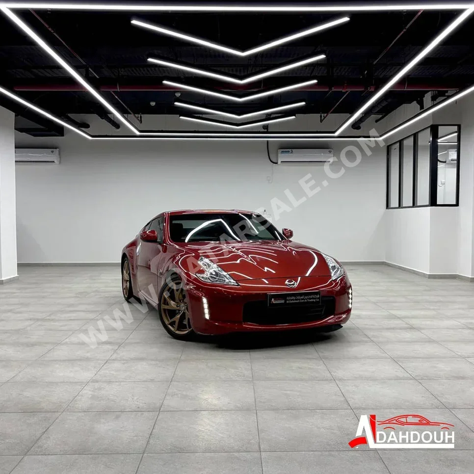 نيسان  زد  370  2013  اوتوماتيك  106,000 كم  6 سلندر  دفع خلفي  كوبيه \ سبورت  أحمر