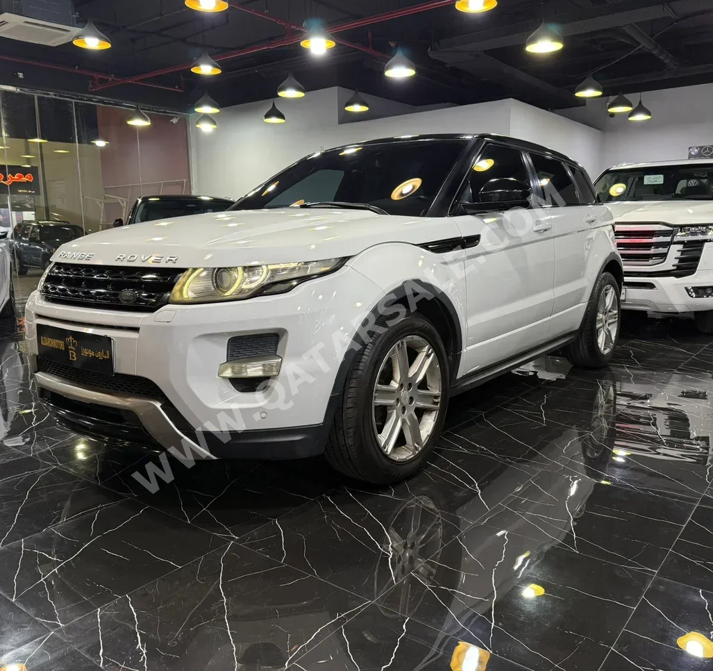 Land Rover  Evoque  2015  Automatic  90,000 Km  4 Cylinder  Four Wheel Drive (4WD)  SUV  White