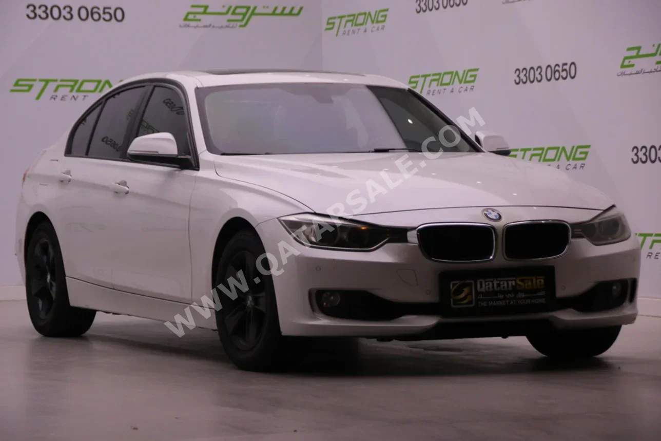 BMW  3-Series  320i  2014  Automatic  243,000 Km  4 Cylinder  Rear Wheel Drive (RWD)  Sedan  White