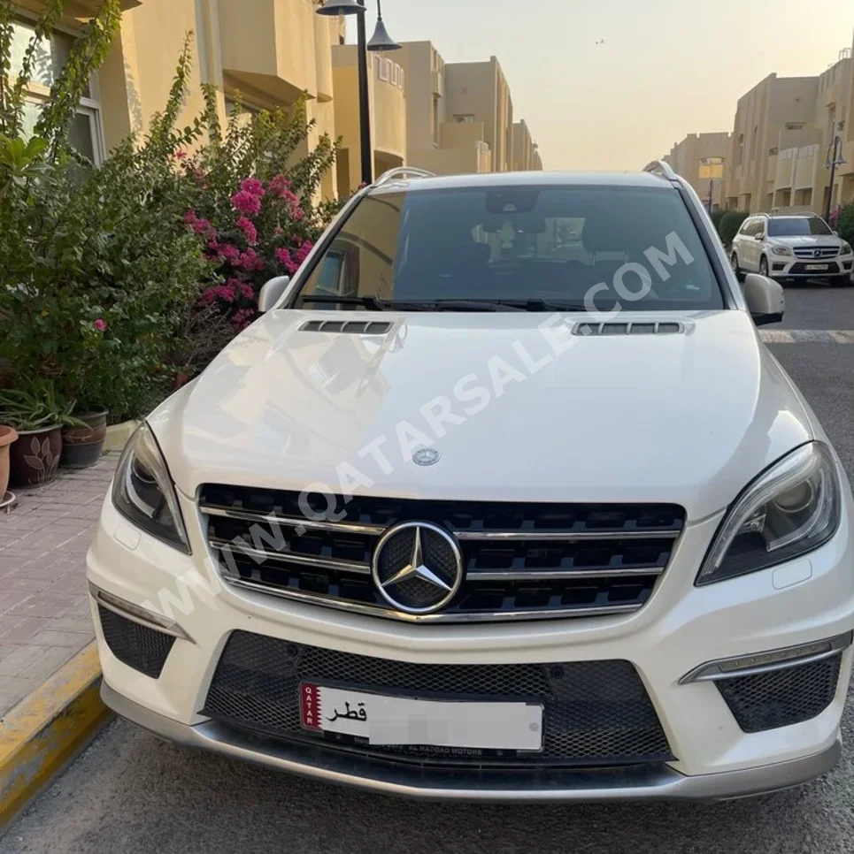 Mercedes-Benz  ML  63 AMG  2013  Automatic  101,050 Km  8 Cylinder  All Wheel Drive (AWD)  SUV  White