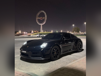 Porsche  911  Carrera  2025  Automatic  7,000 Km  6 Cylinder  Rear Wheel Drive (RWD)  Coupe / Sport  Black  With Warranty