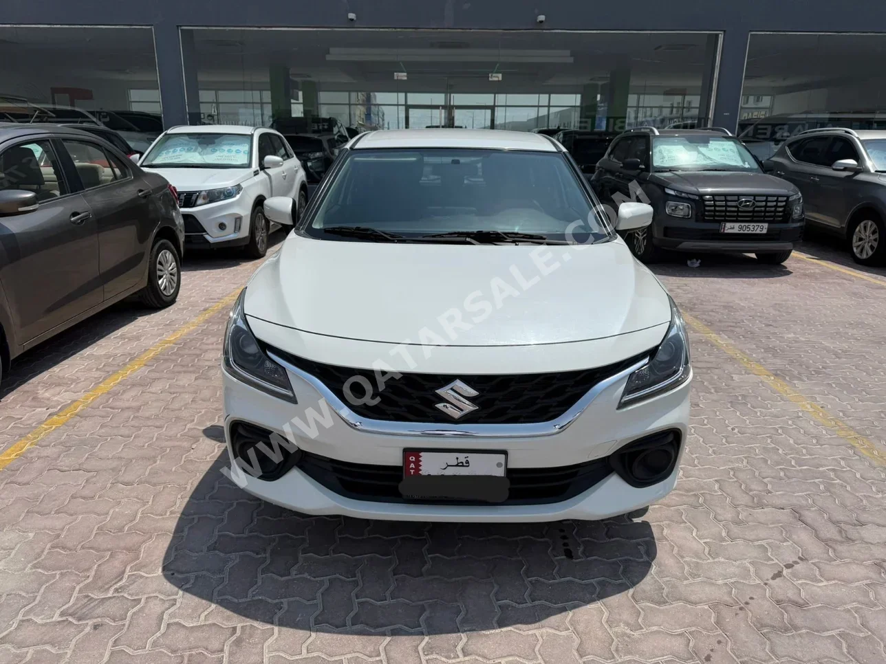 Suzuki  Baleno  2024  Automatic  23,000 Km  4 Cylinder  Front Wheel Drive (FWD)  Hatchback  White  With Warranty