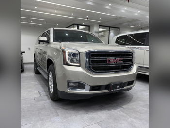 GMC  Yukon  XL  2015  Automatic  298,000 Km  8 Cylinder  Four Wheel Drive (4WD)  SUV  Gold
