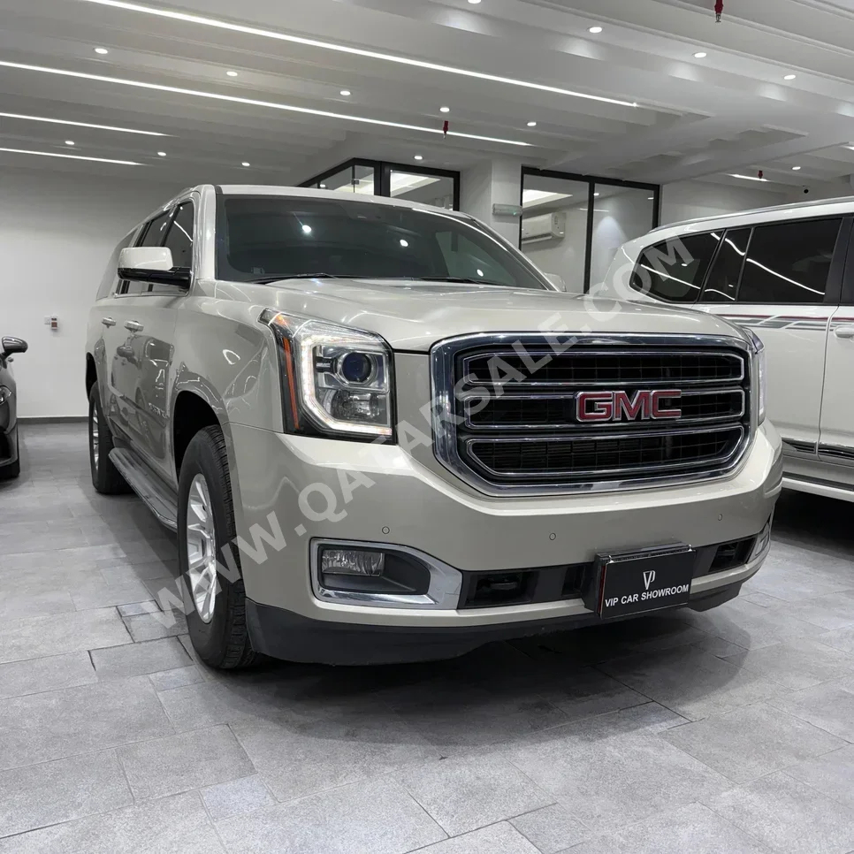 GMC  Yukon  XL  2015  Automatic  298,000 Km  8 Cylinder  Four Wheel Drive (4WD)  SUV  Gold