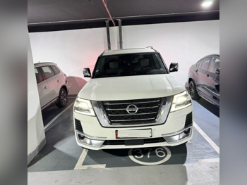 Nissan  Patrol  Platinum  2021  Automatic  97,700 Km  6 Cylinder  Four Wheel Drive (4WD)  SUV  White