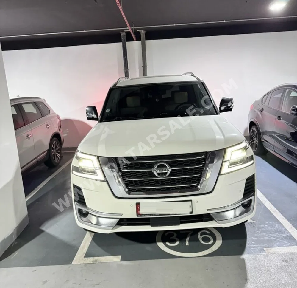 Nissan  Patrol  Platinum  2021  Automatic  97,700 Km  6 Cylinder  Four Wheel Drive (4WD)  SUV  White