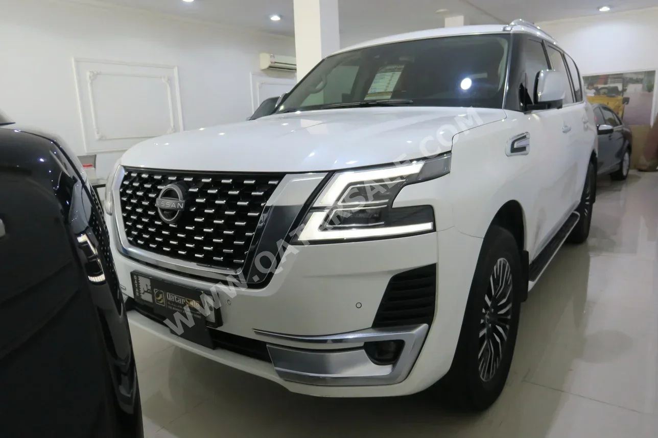 Nissan  Patrol  Platinum  2023  Automatic  70,000 Km  6 Cylinder  Four Wheel Drive (4WD)  SUV  White  With Warranty