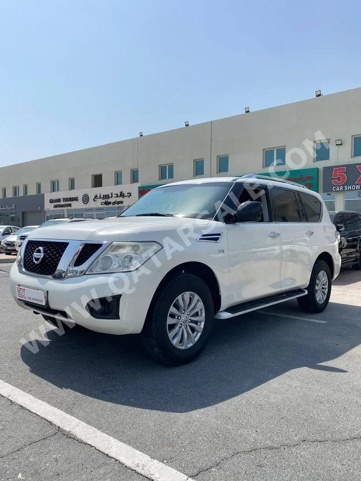 Nissan  Patrol  XE  2014  Automatic  239,000 Km  6 Cylinder  Four Wheel Drive (4WD)  SUV  White