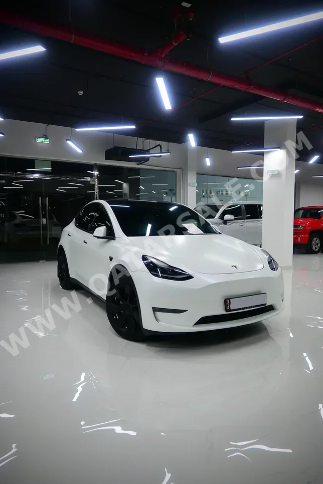 Tesla  Model Y  2024  Automatic  21,000 Km  0 Cylinder  Rear Wheel Drive (RWD)  Sedan  White  With Warranty