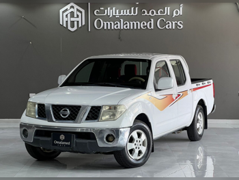 Nissan  Navara  SE  2011  Manual  245,000 Km  4 Cylinder  Rear Wheel Drive (RWD)  Pick Up  White