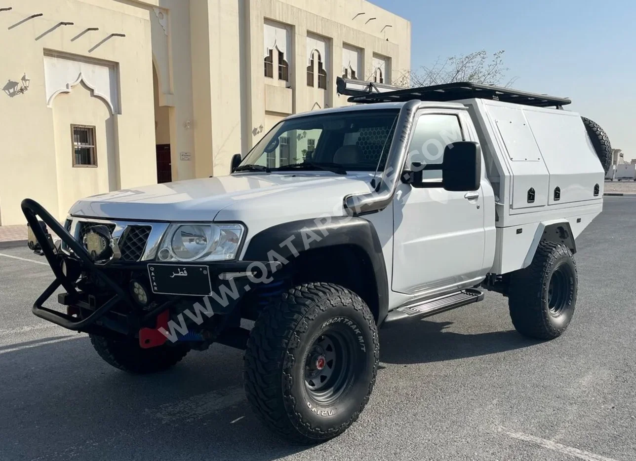 Nissan  Patrol  Pickup  2013  Manual  139,000 Km  6 Cylinder  Four Wheel Drive (4WD)  Pick Up  White