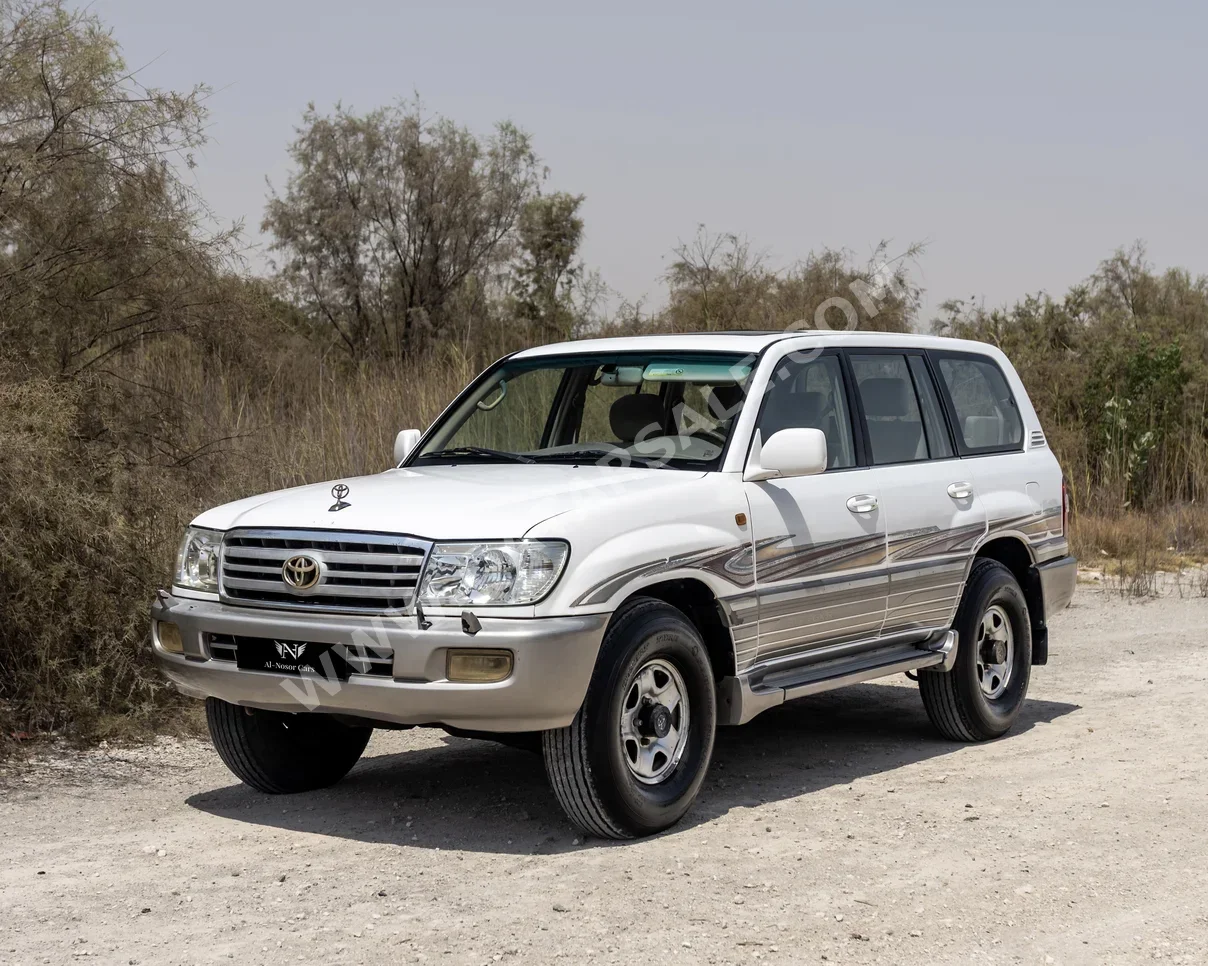 تويوتا  لاند كروزر  جي اكس ار  2004  عادي  250,000 كم  6 سلندر  دفع رباعي  اس يو في  أبيض